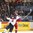 TORONTO, CANADA - DECEMBER 31: Slovakia's Miroslav Struska #25 is bodychecked by Russia's Kirill Belyayev #14 in the third period during preliminary round action at the 2017 IIHF World Junior Championship. (Photo by Matt Zambonin/HHOF-IIHF Images)

